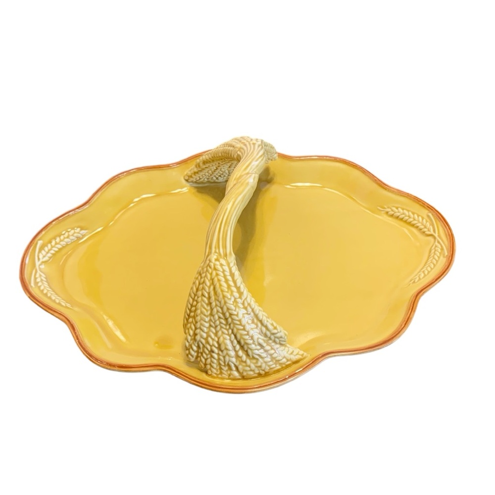 Mustard yellow and brown serving platter with ceramic wheat handle.